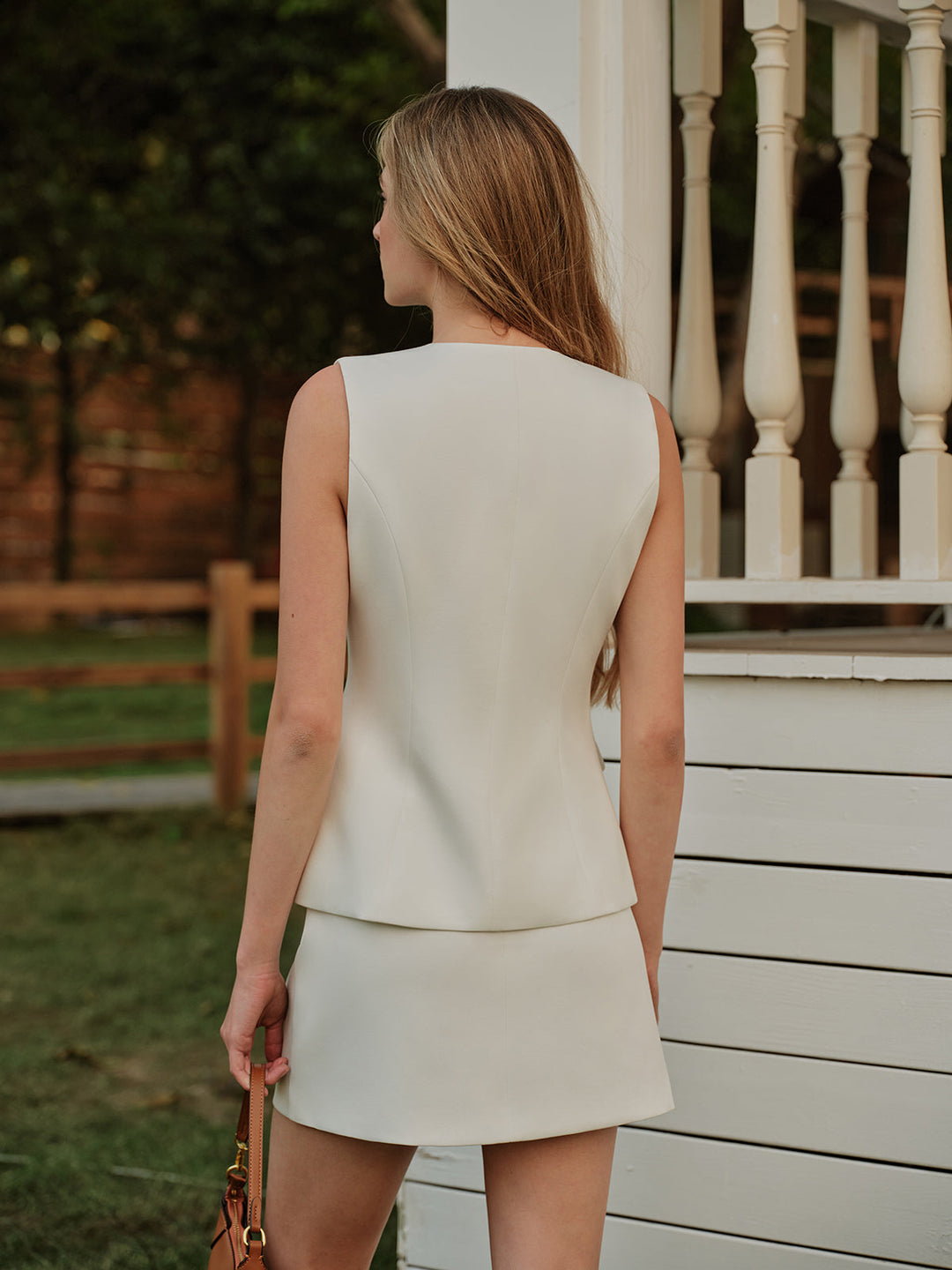 Elegant Metal Button Split Vest and Skirt Set  Liora Lane Boutique Skirt Sets